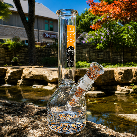 An Encore Basketweave Henny Pounder bong with a woven orange pattern