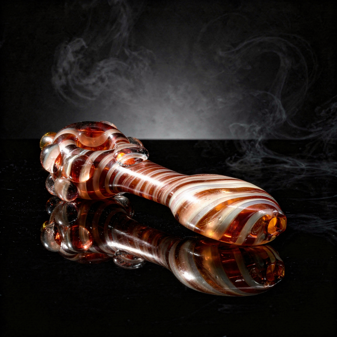 An Encore 5-inch fumed glass spoon hand pipe
