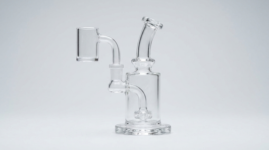 A clear quartz banger on a glass dab rig