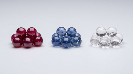 Red ruby, blue sapphire and clear quartz terp pearls grouped separately